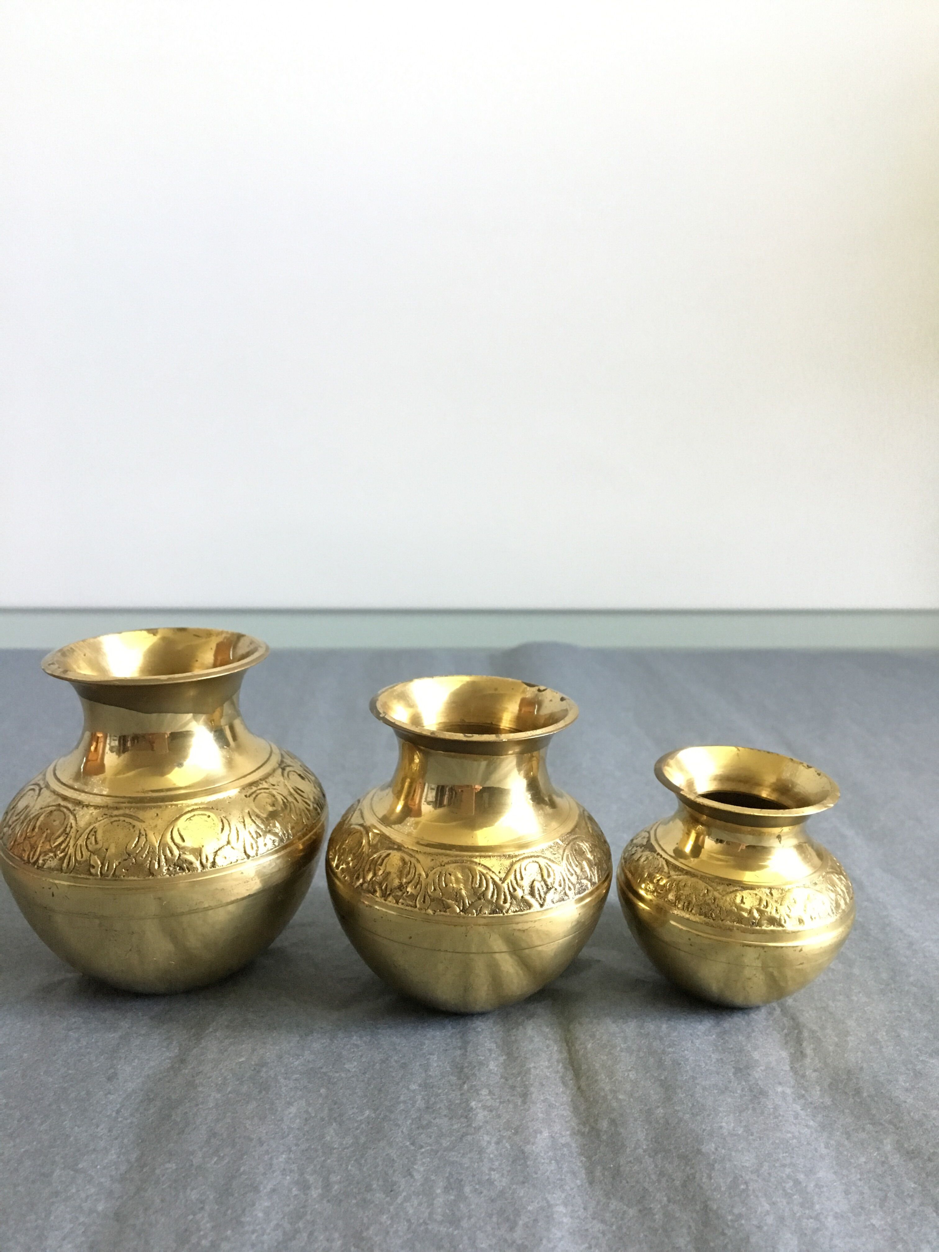 Three small brass vases