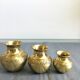Three small brass vases