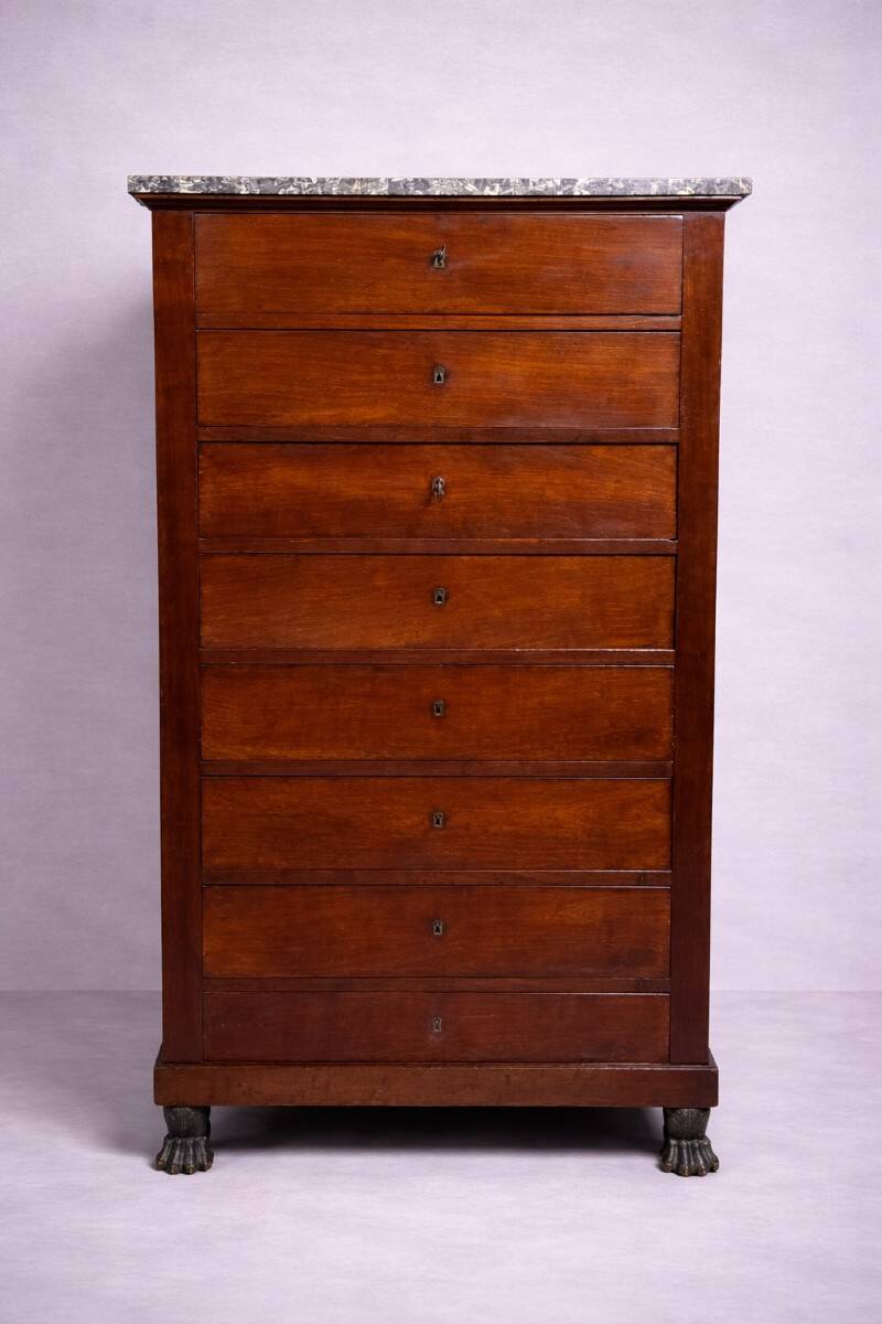 Empire Restoration period chest of drawers in mahogany, with a marble top.