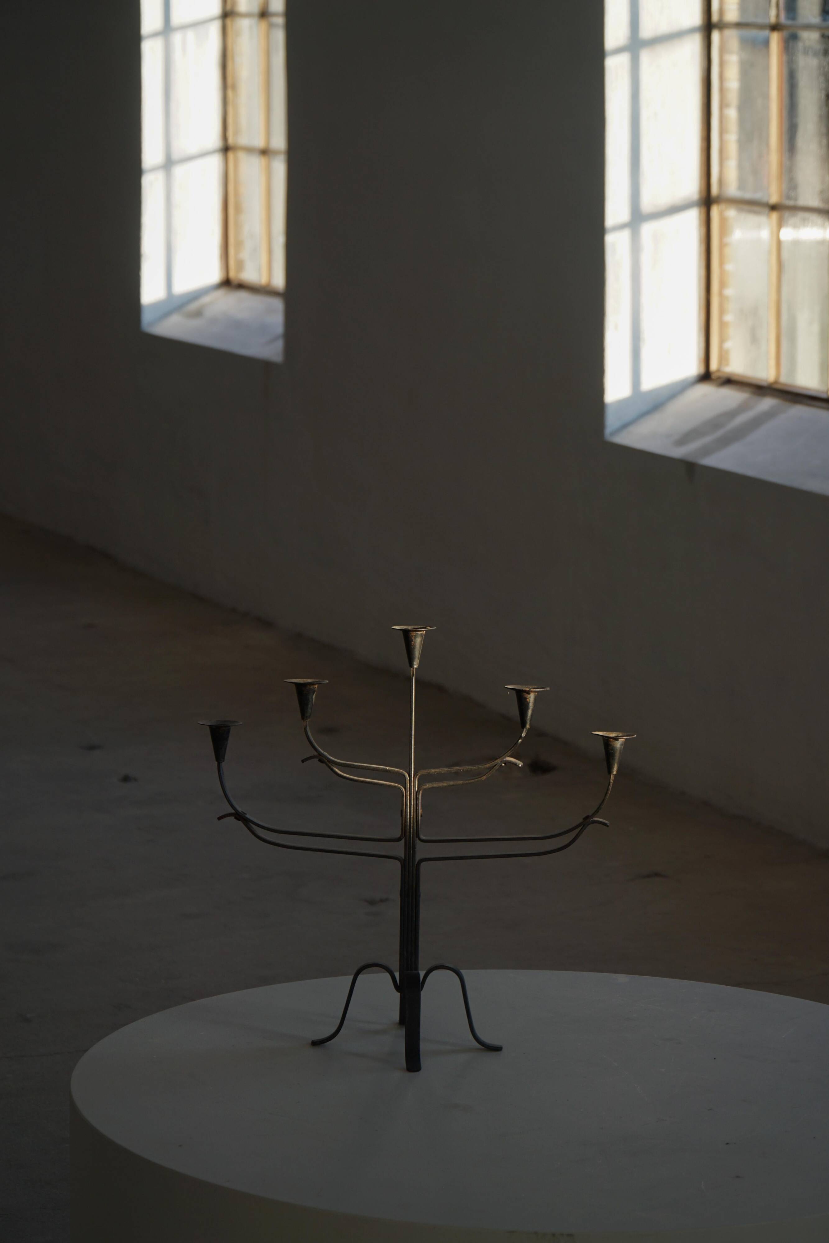 Brutalist Scandinavian candlestick in wrought iron and metal from the mid-20th century.