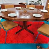 Baumann style round table with integrated extensions from the 70s