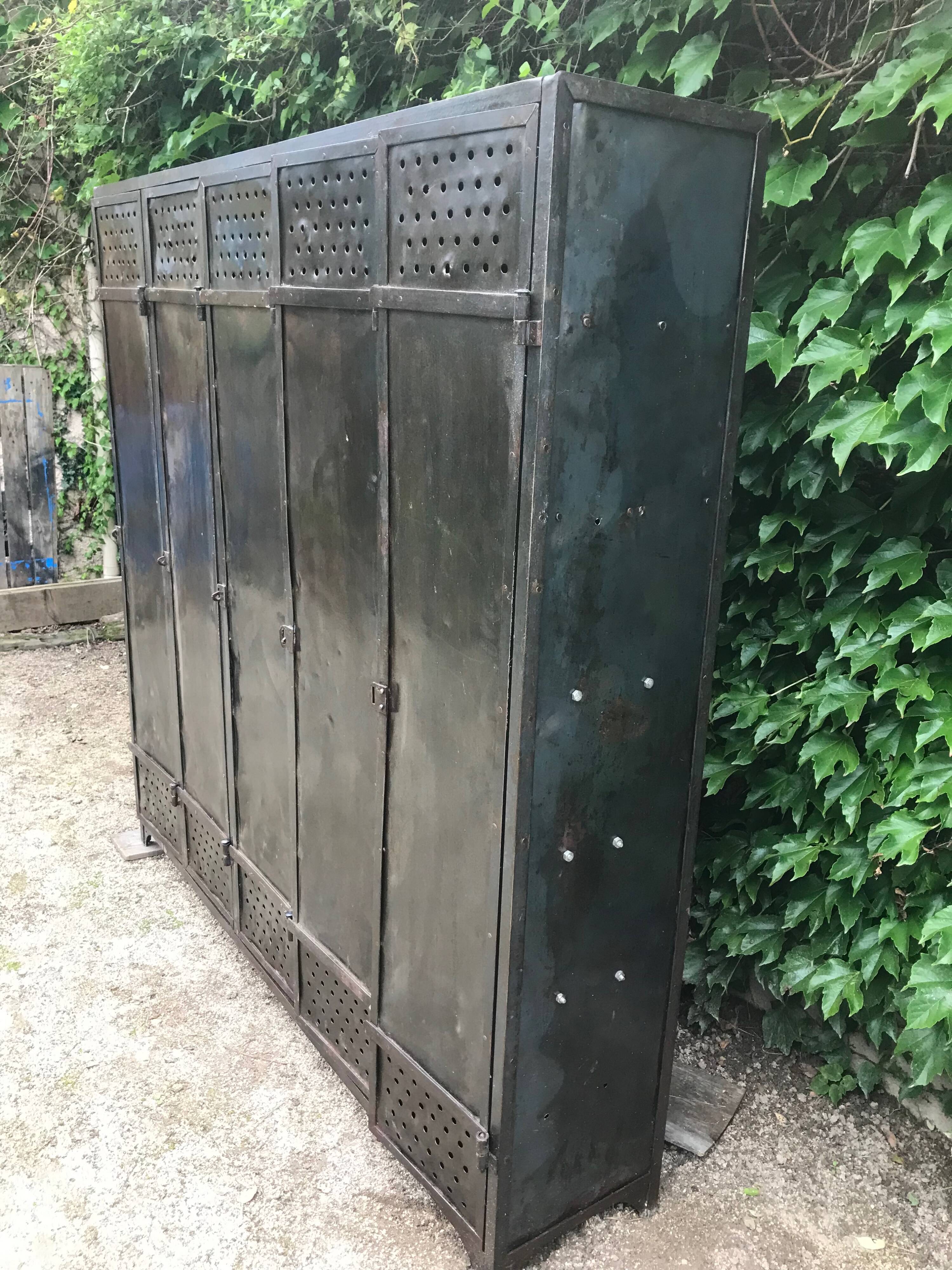 Very old riveted 5-door locker room