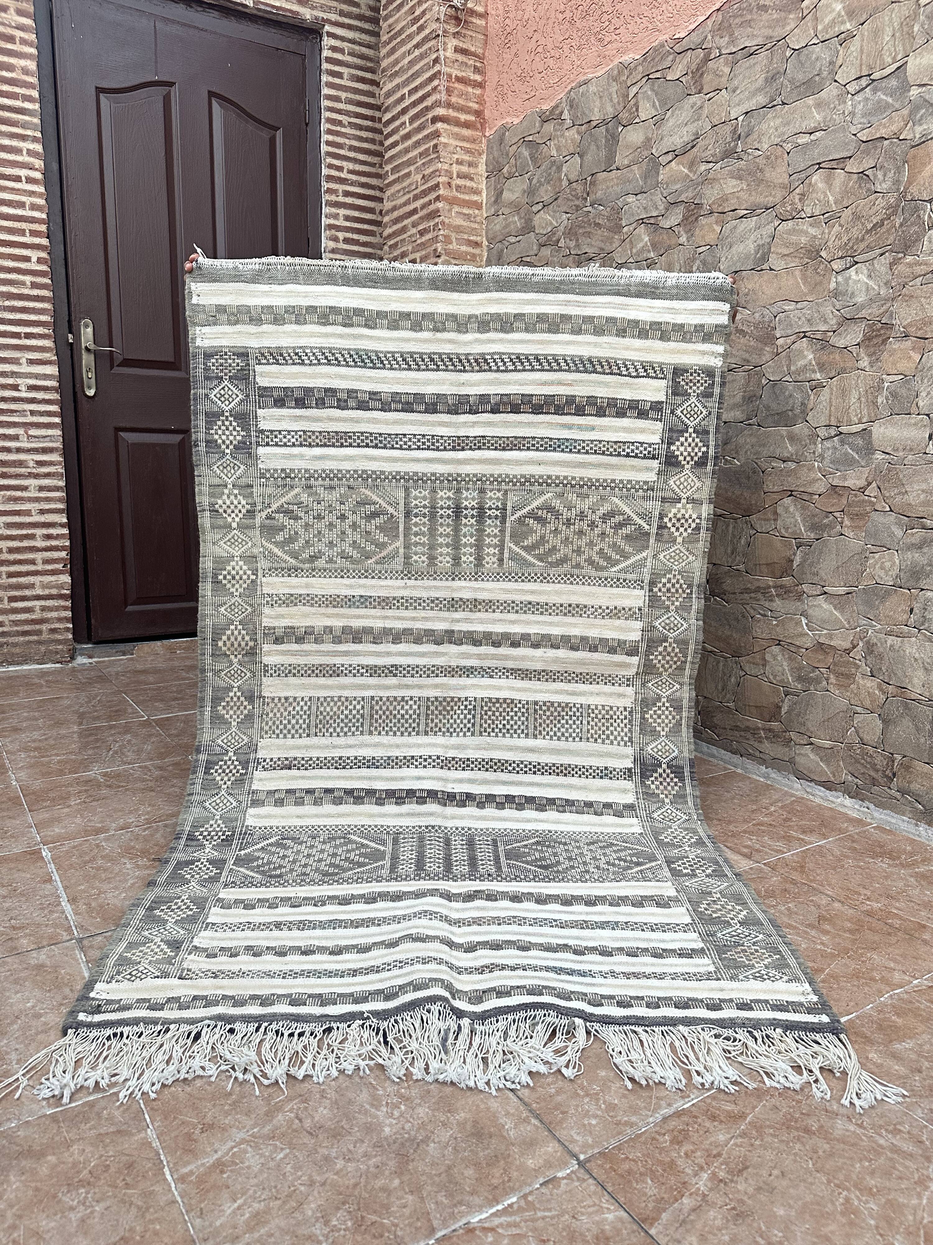 Handwoven Kilim rug made of camel wool, silk, and cactus.