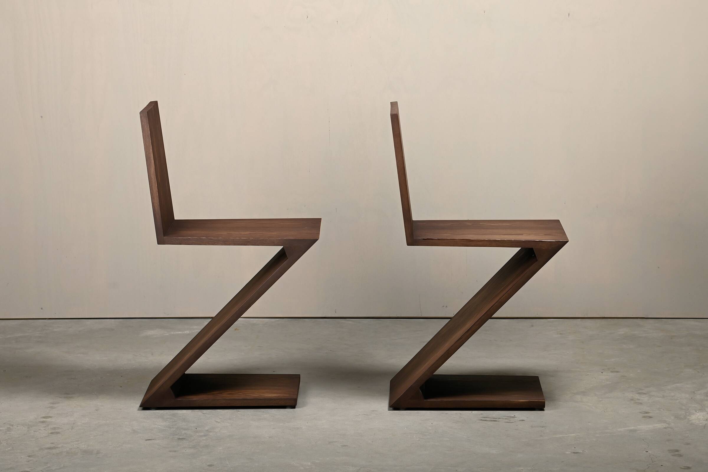 Gerrit Rietveld Zig Zag Chair is dark brown stained wood