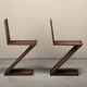 Gerrit Rietveld Zig Zag Chair is dark brown stained wood