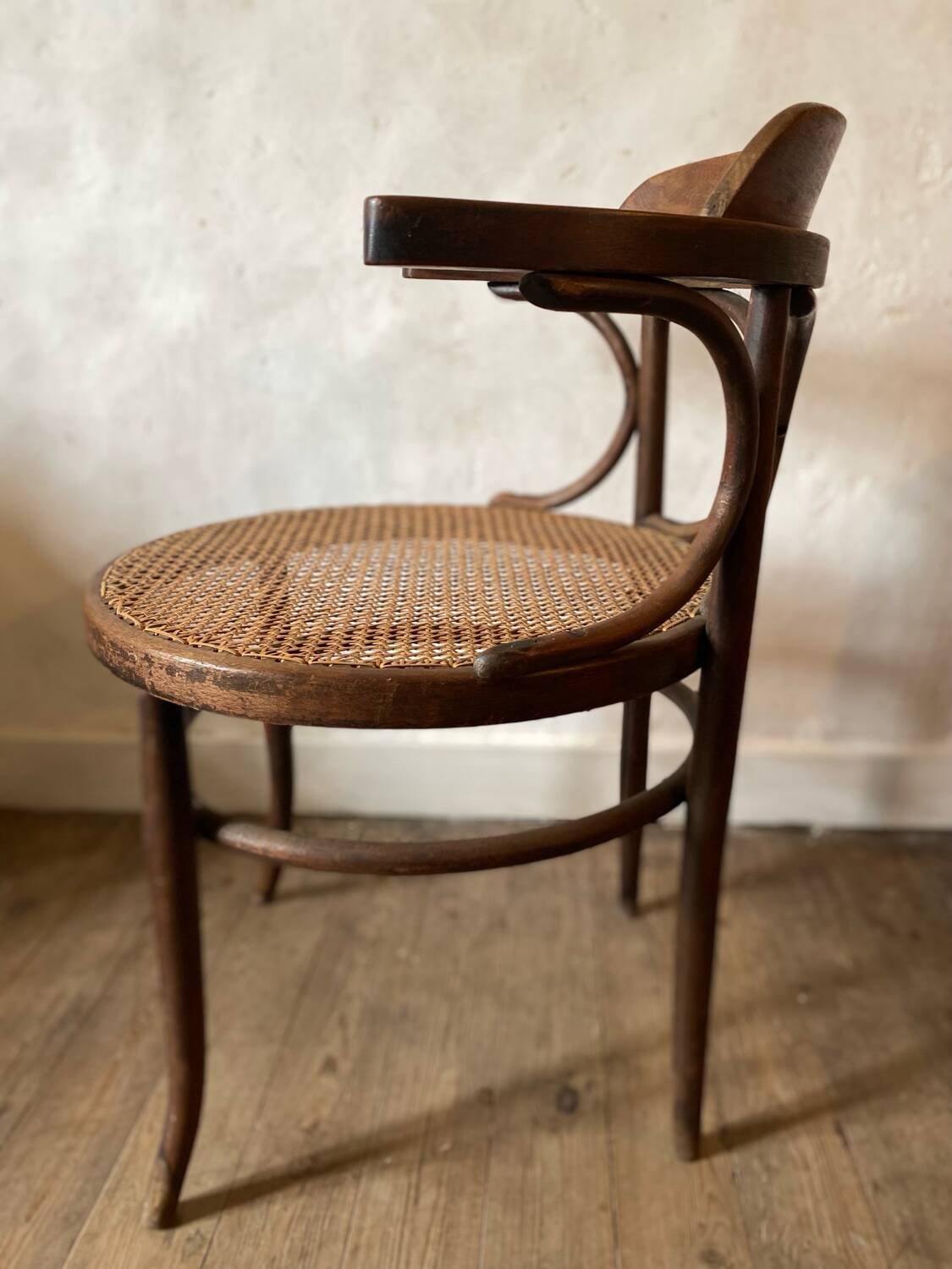 Cane and curved wood armchair