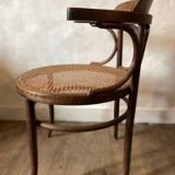 Cane and curved wood armchair