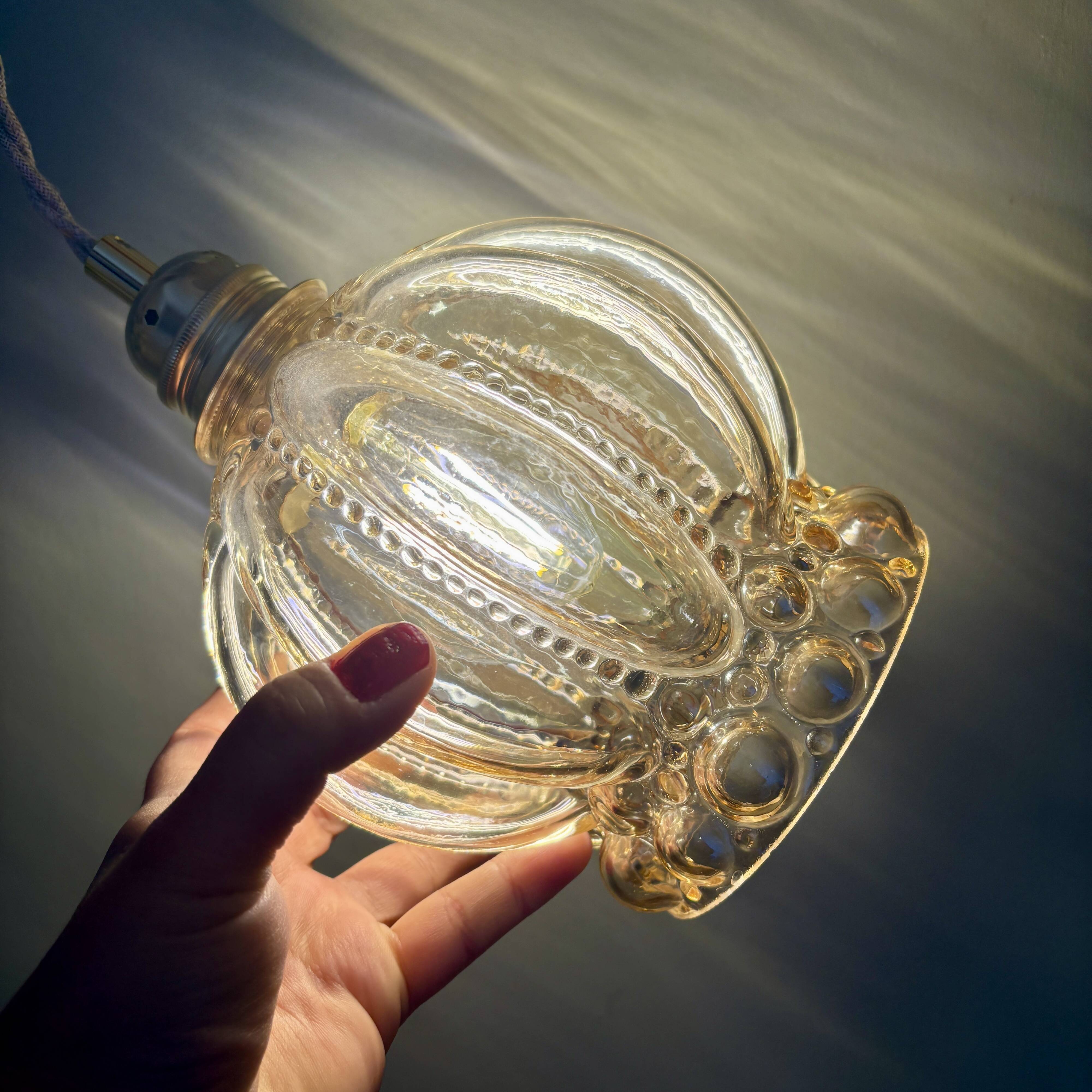 Vintage globe pendant light in amber bubble glass