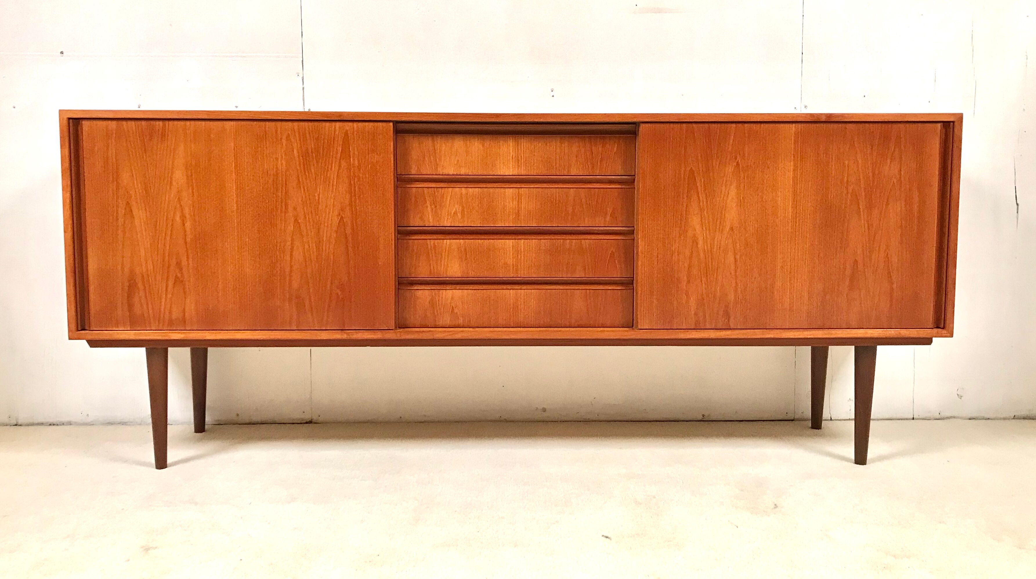 Danish teak sideboard with two sliding doors and 4 central drawers
