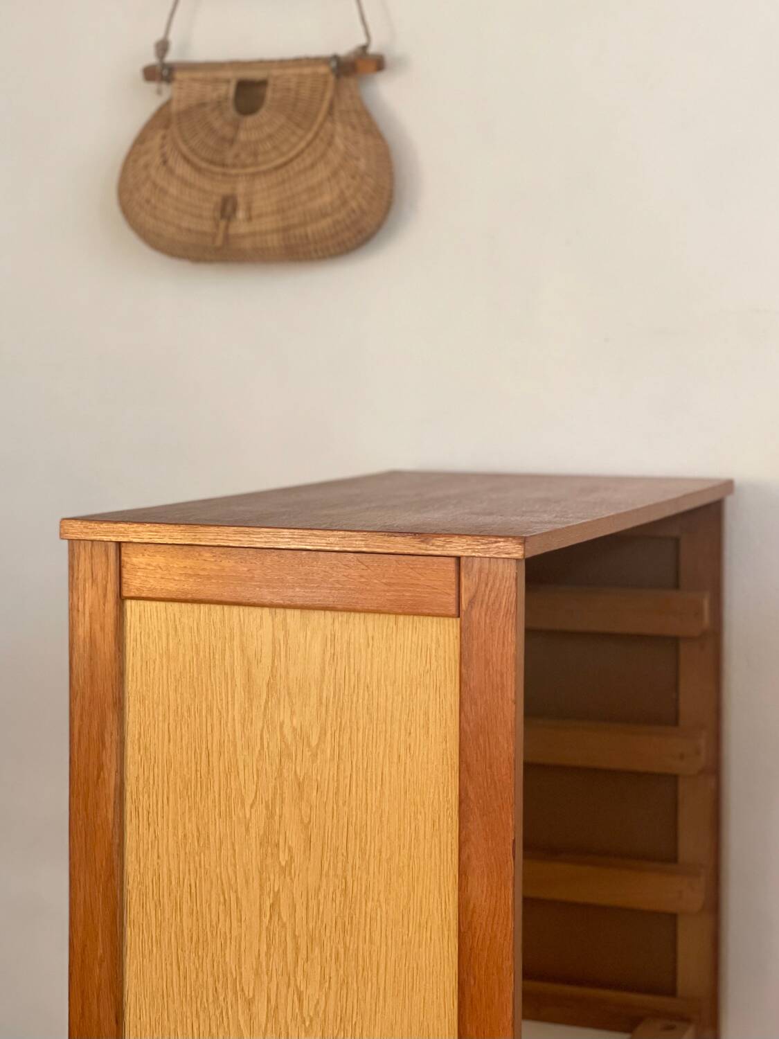 Vintage 1960s chest of drawers with covered handles.