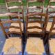 6 solid wood chairs in dark oak with a glossy finish and straw.