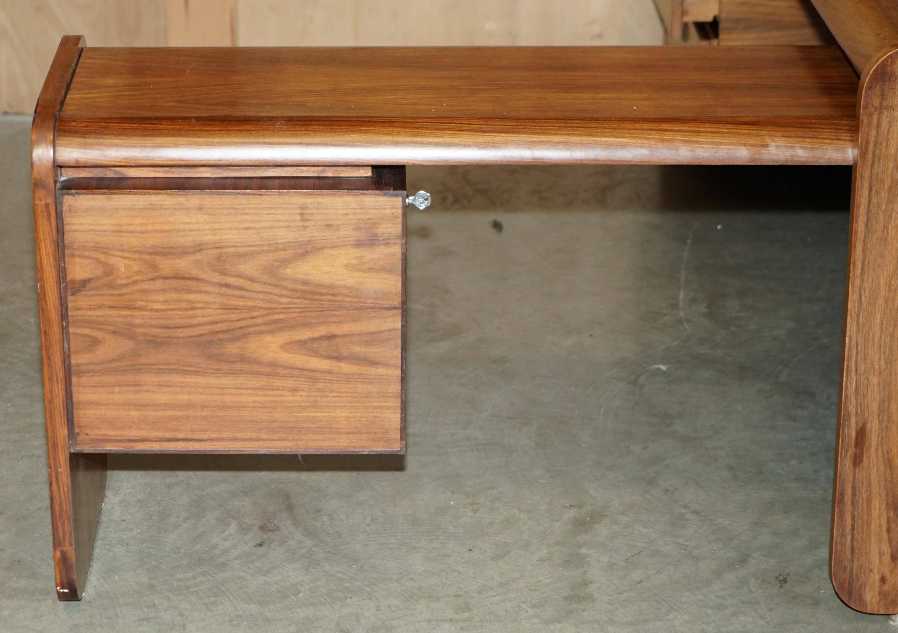 Mid-century modern right-angle desk in Brazilian wood.