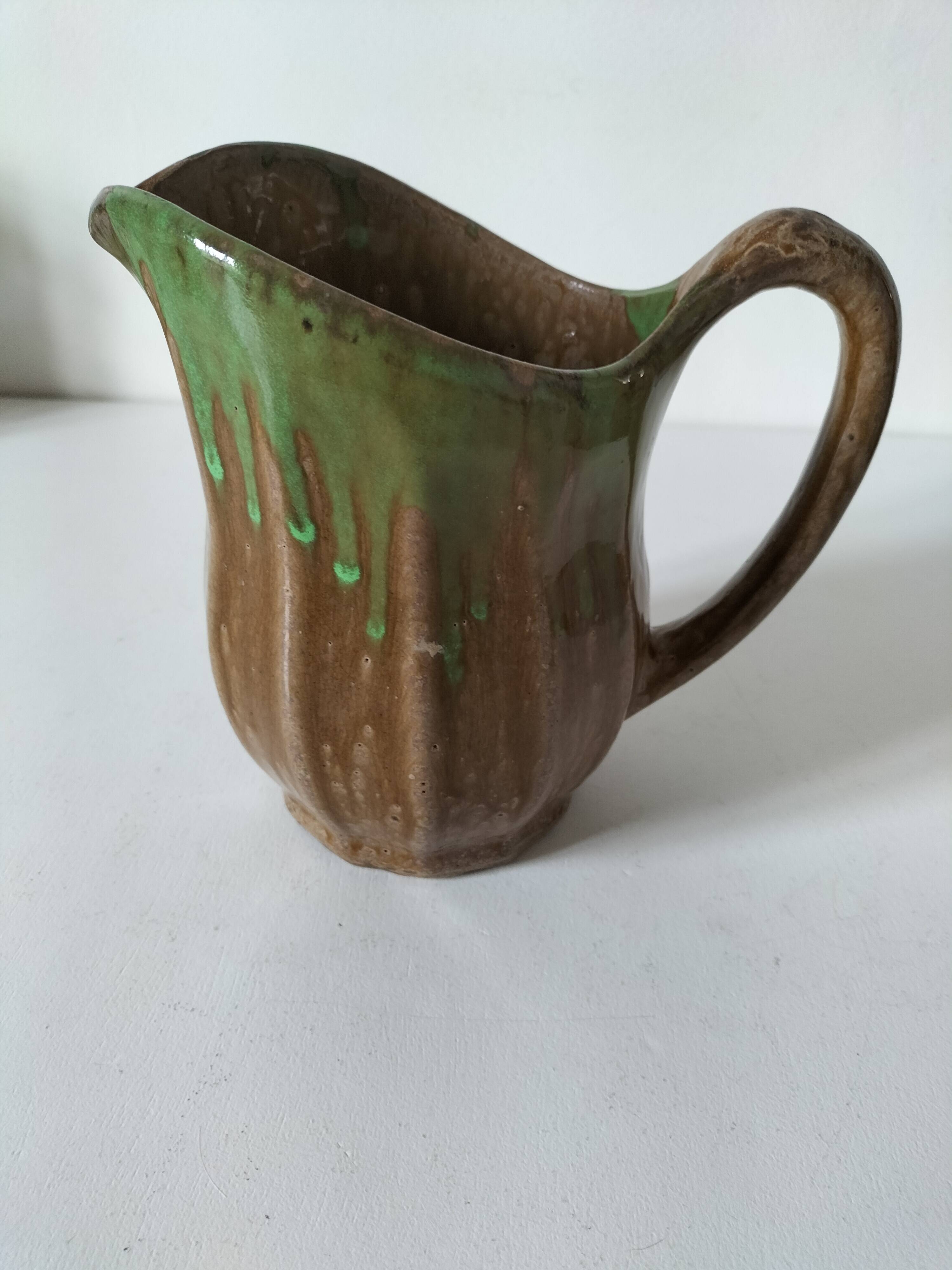 Handcrafted green and brown glazed ceramic pitcher, 1960s-70s