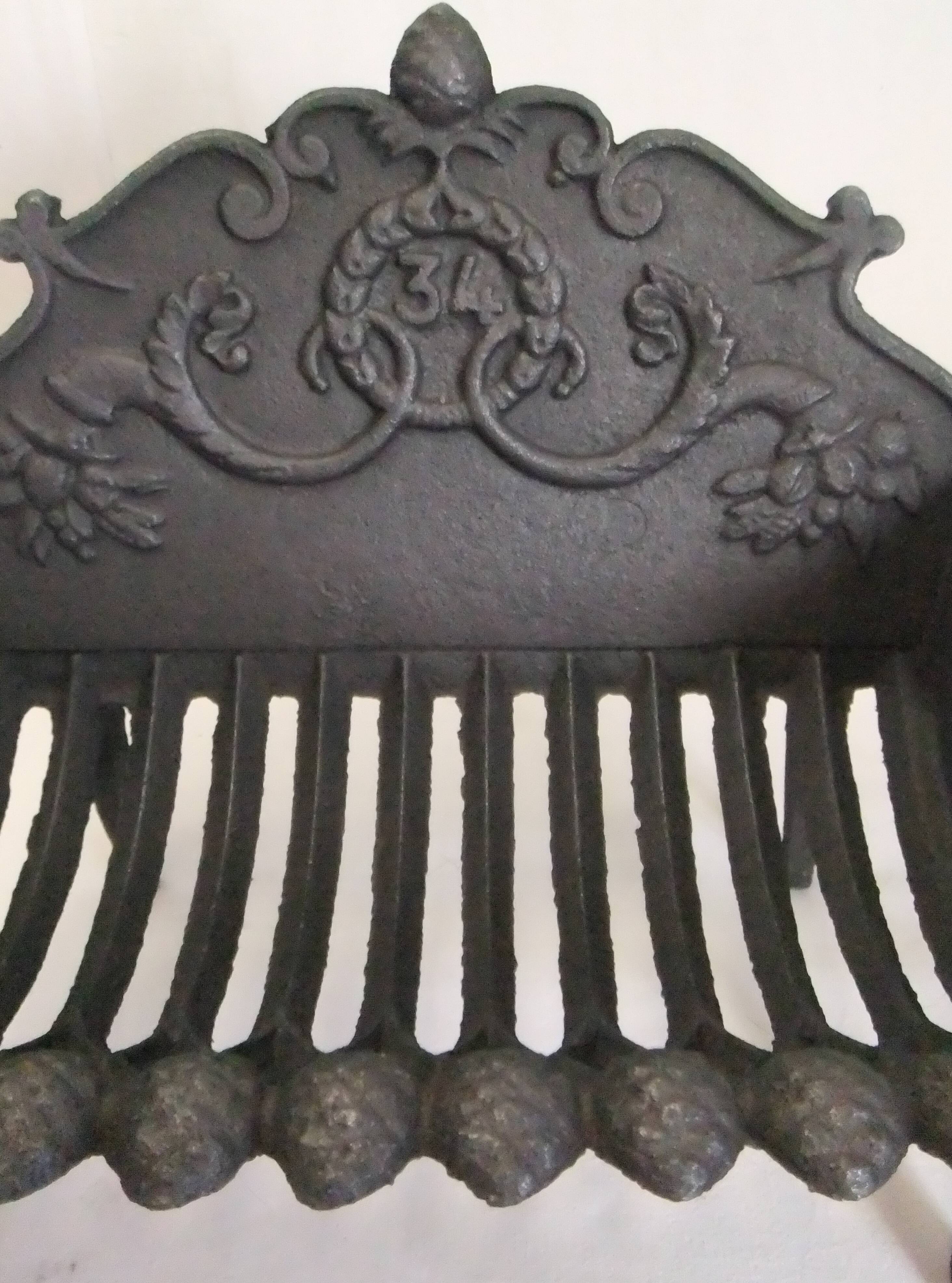 Old cast iron log holder andiron fireplace cornucopia pine cone