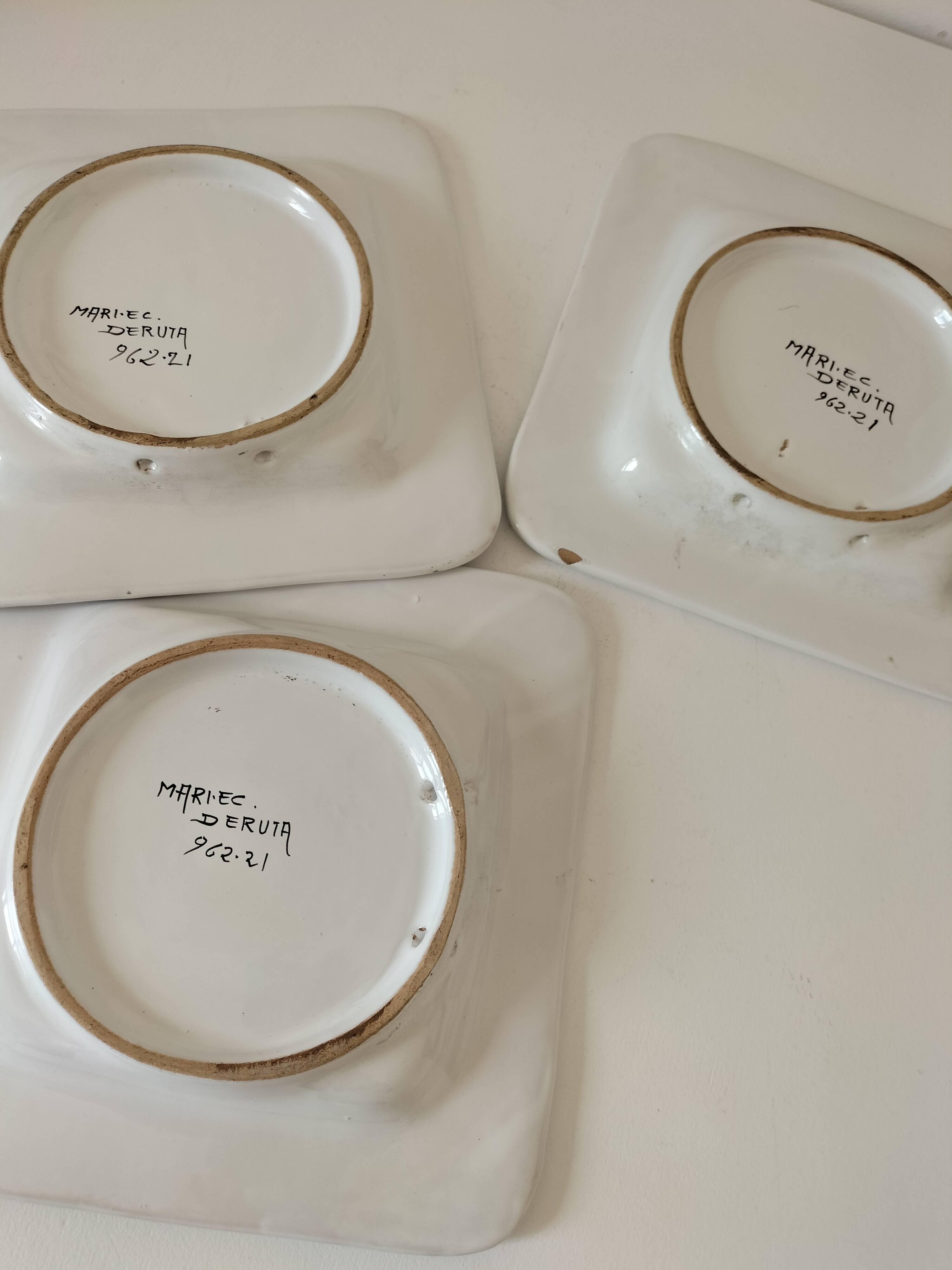 Trio of square Deruta plates signed MARI E.C., botanical decoration 962.21