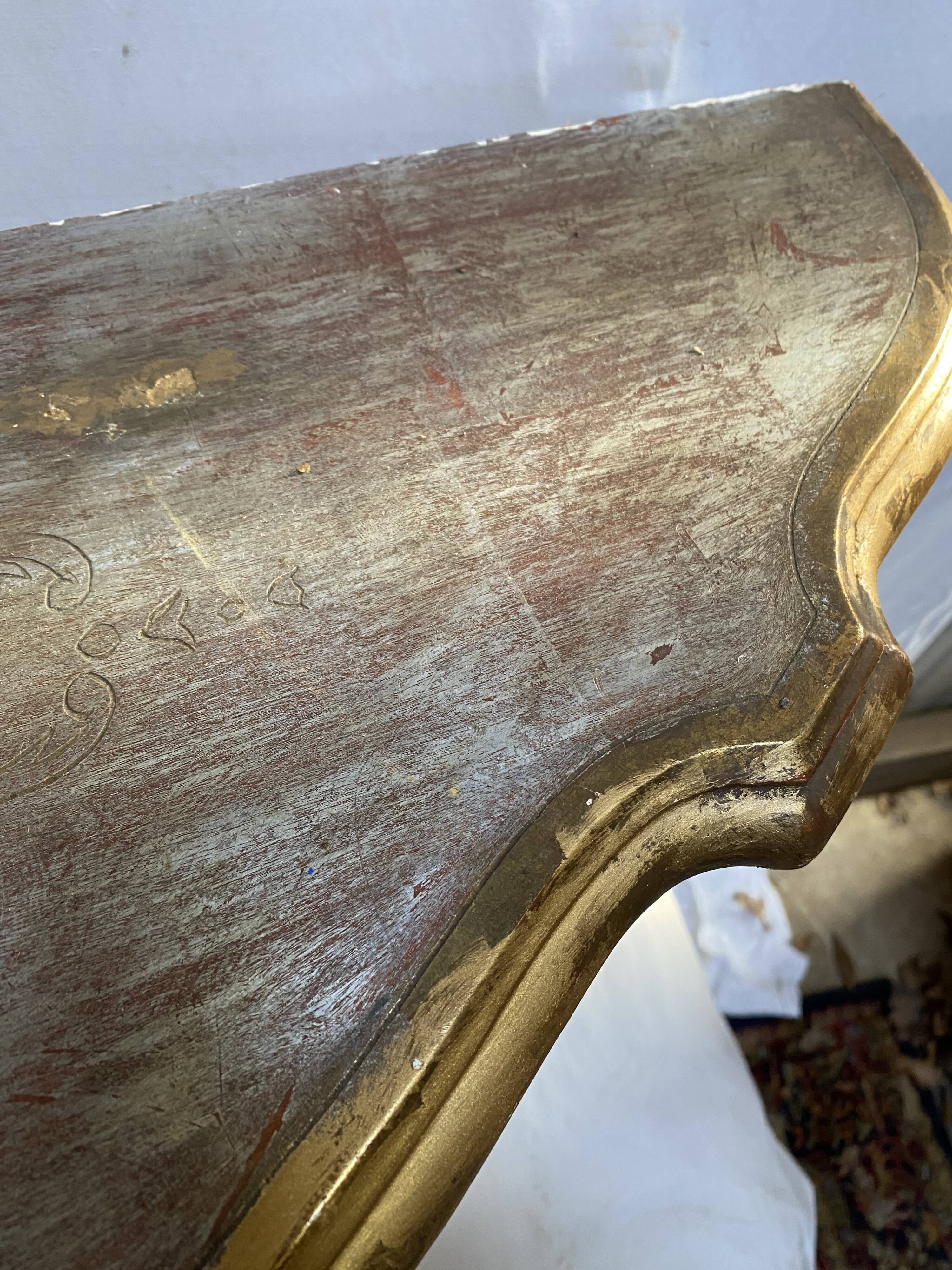Wooden wall console and antique gilded stucco