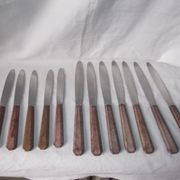 Set of knives with brown Bakelite handles.