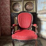 Napoleon III medallion armchair in carved wood and red velvet.