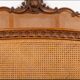 Louis XV style bed in carved and caned beech