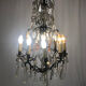 Black lacquered metal chandelier and crystal tassels