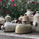 Old vinaigrier in sandstone vintage pot