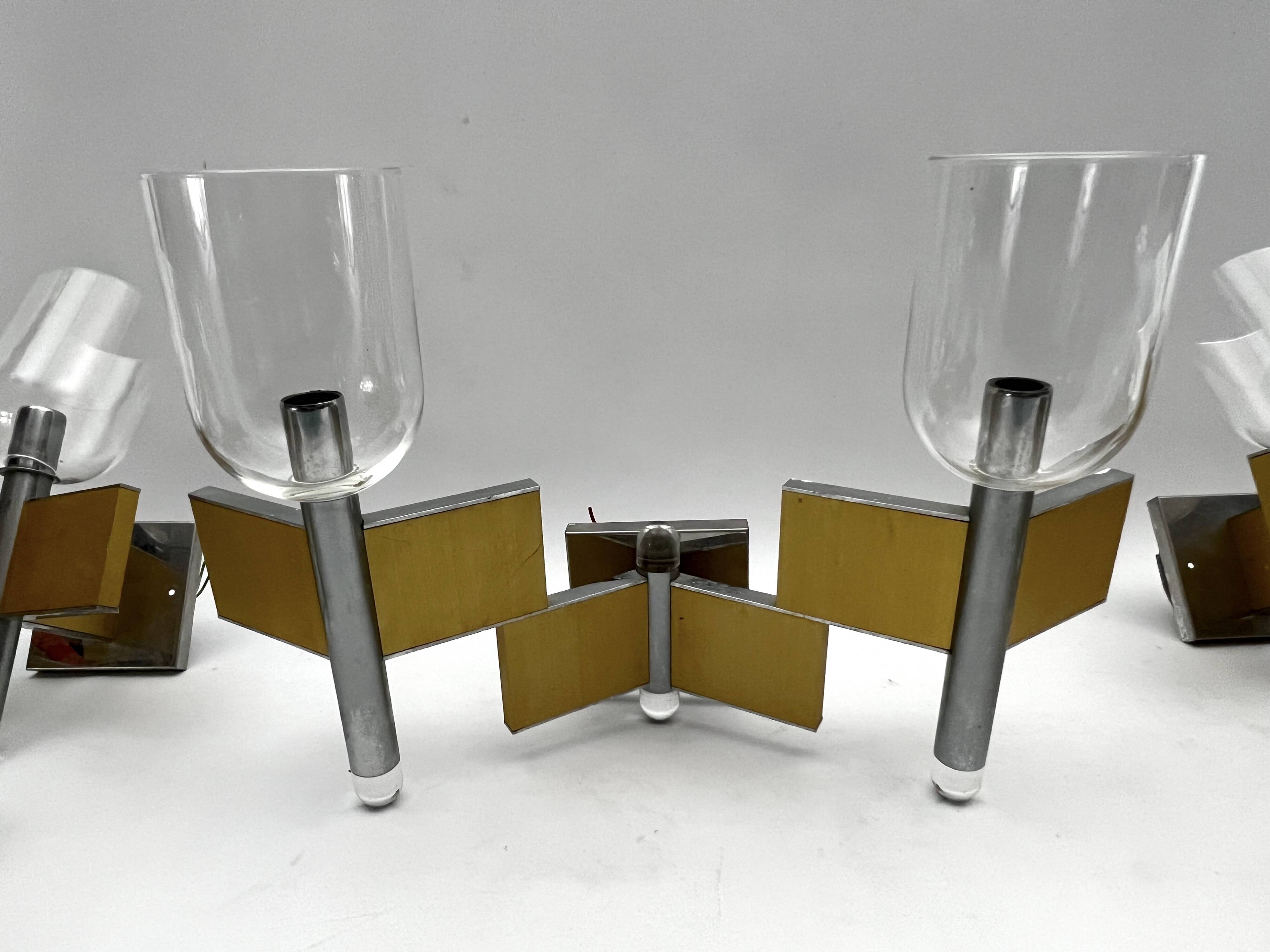 Mid-Century Modern set of eight brass and chrome sconces by Sciolari. Italy 1970s
