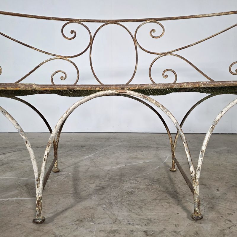 Beautiful curved garden bench from the late 19th century in iron.