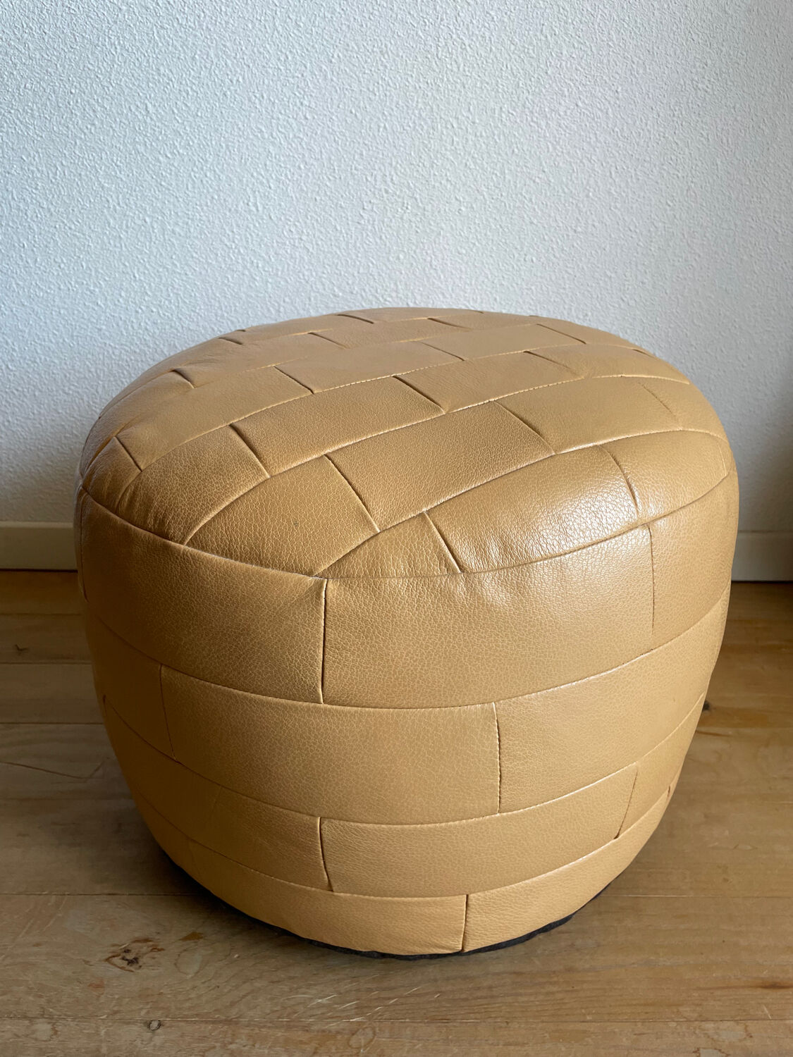 Beige patchwork leather pouf from Sède