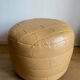 Beige patchwork leather pouf from Sède