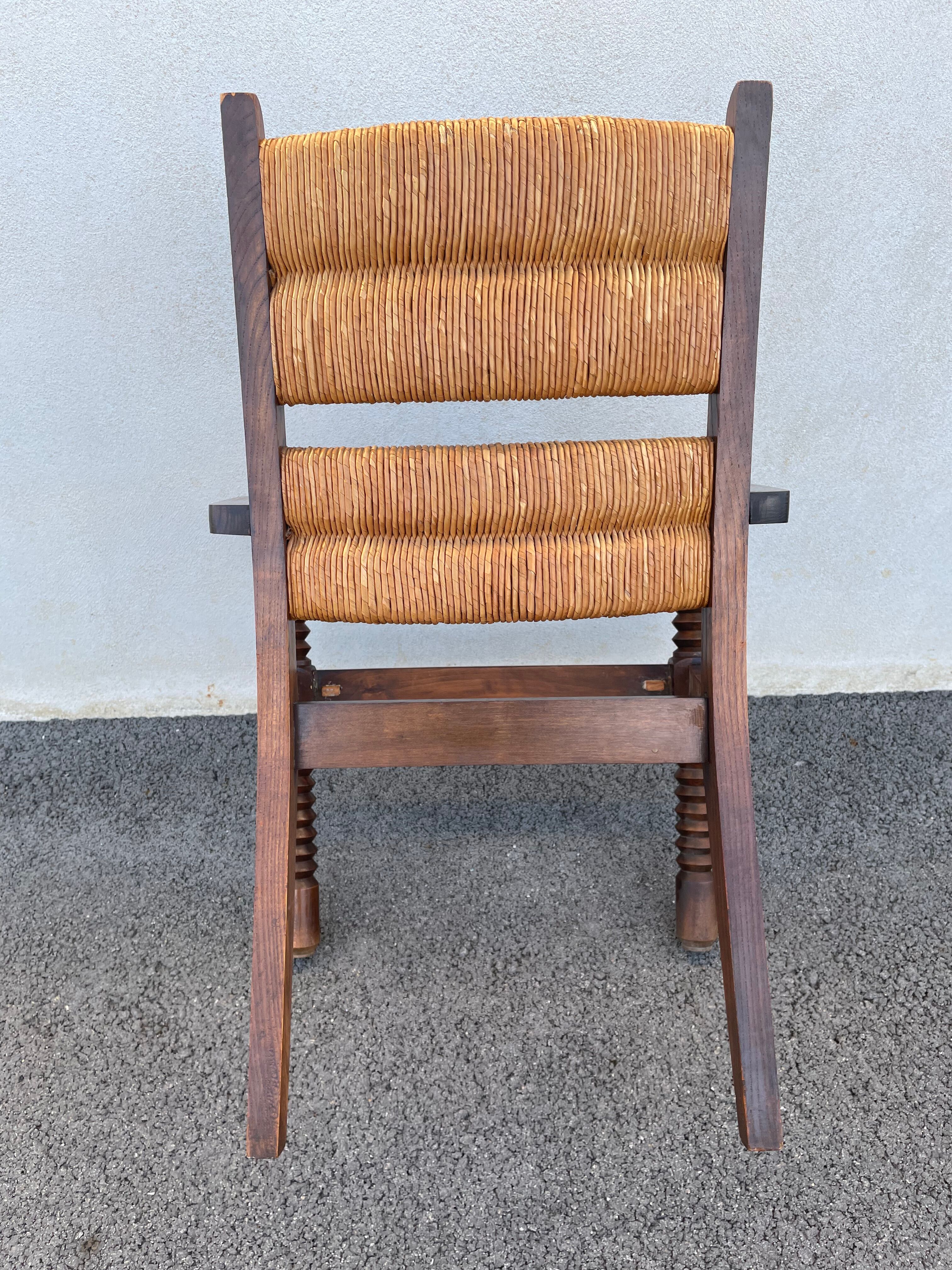 Vintage armchair in straw and brutalist wood