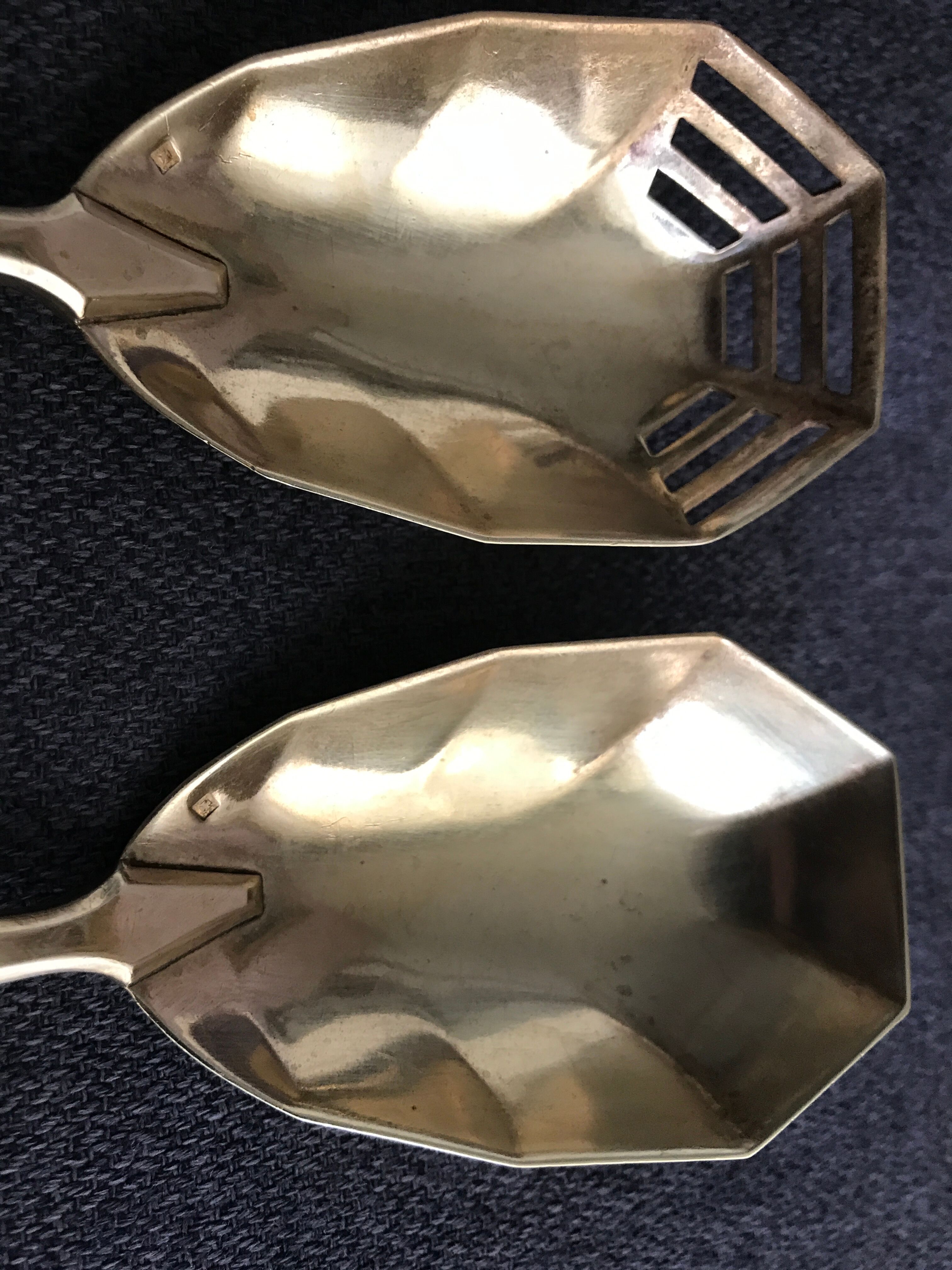Pair of serving spoons in silver hallmark neck brace