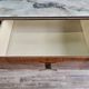 Mid-century drawer chest in mahogany, brass and glass.