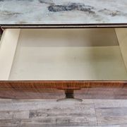 Mid-century drawer chest in mahogany, brass and glass.