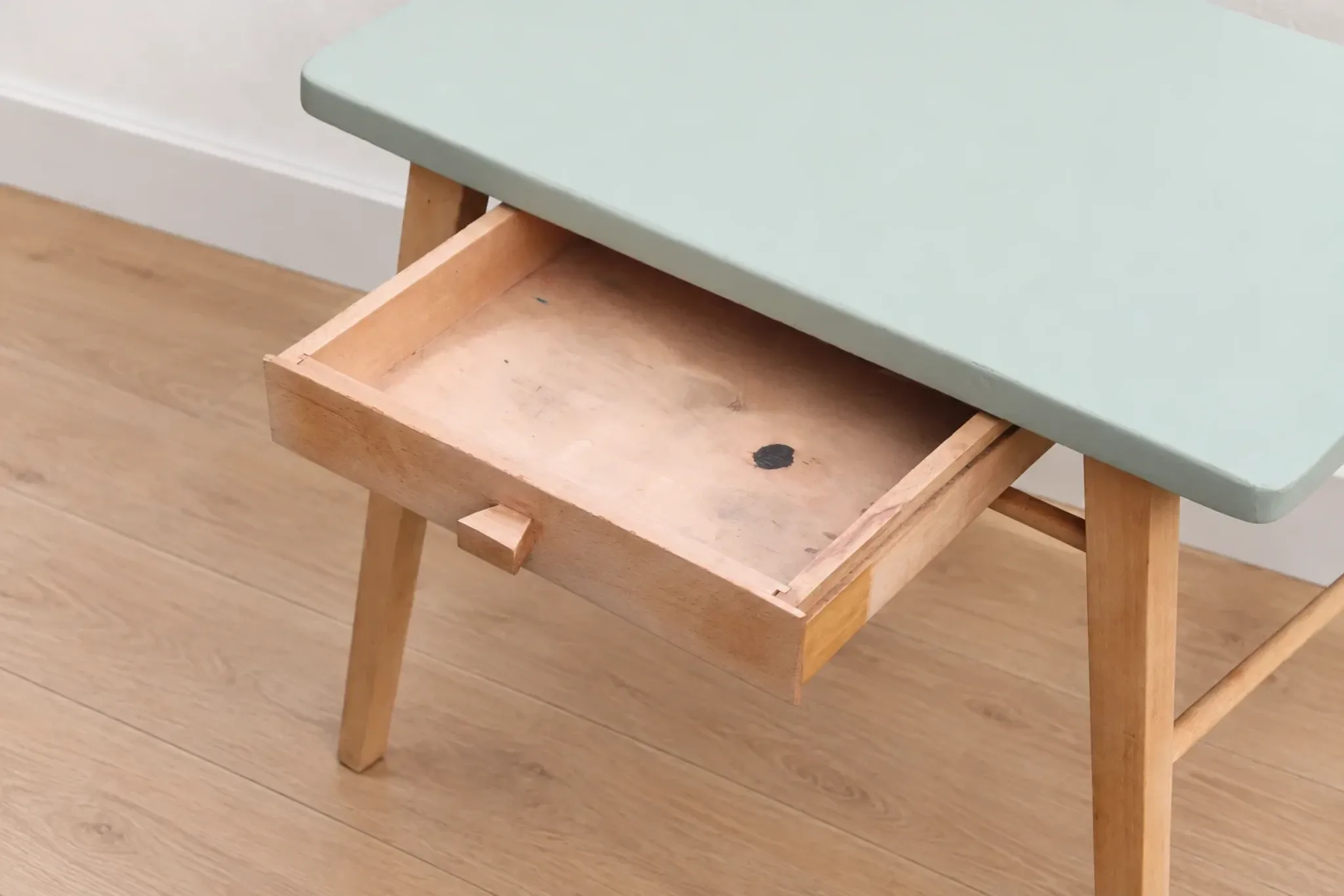 Small vintage children's desk attributed to Baumann – natural wood and lizard green top.