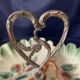 Beggar or servant in barbotine with fruit decoration heart handle