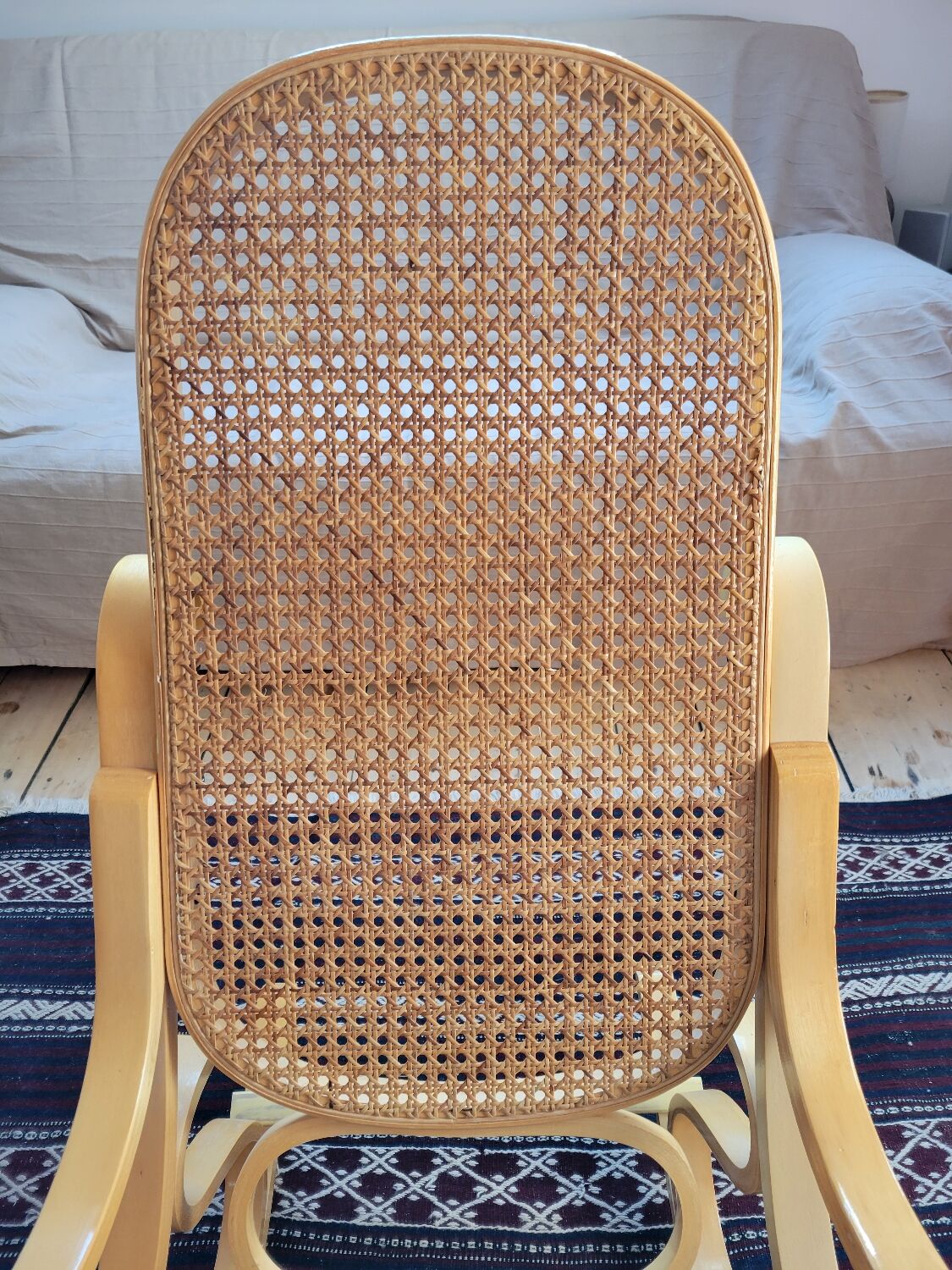 Rocking chair in arched wood and cane