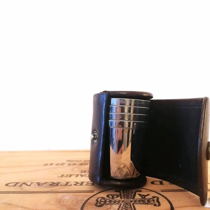 Liquor service in its leather case