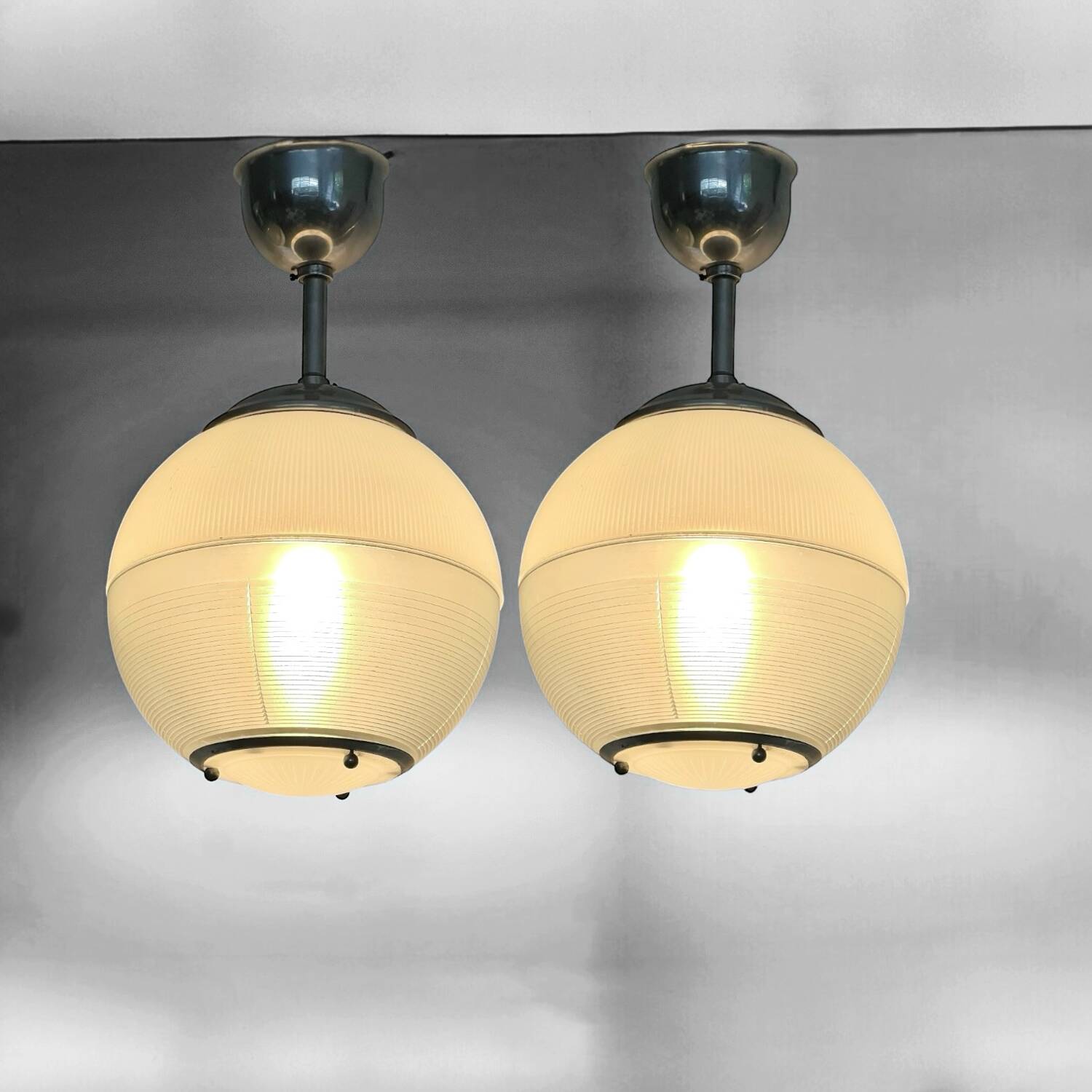 Pair of Holophane industrial design ball pendant lights