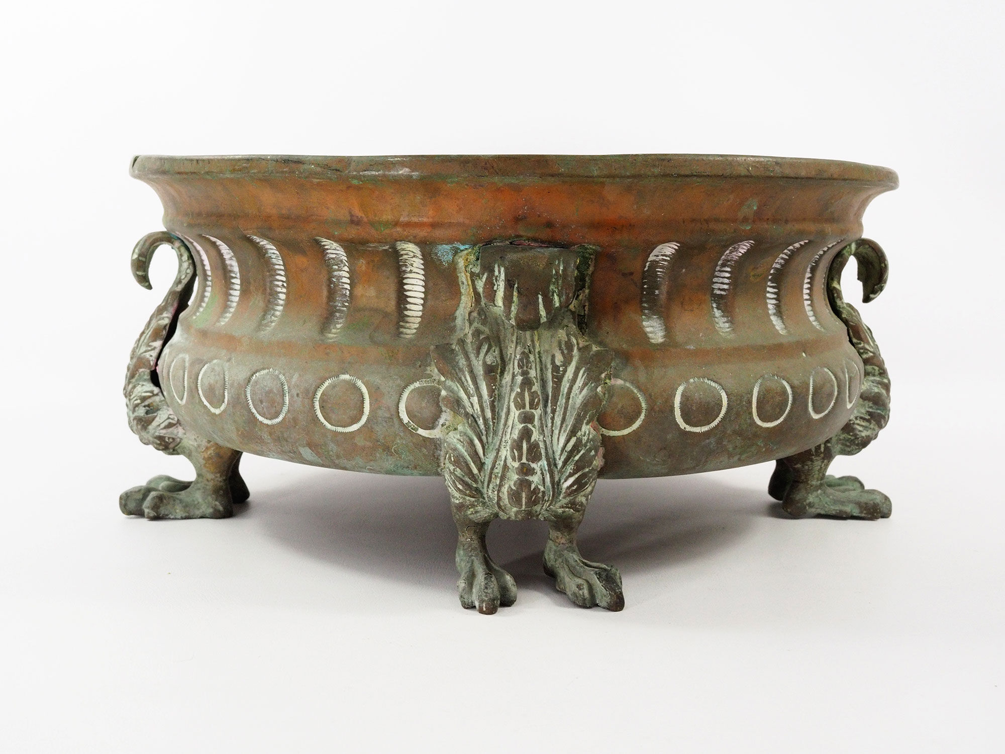 Repelled copper planter with acanthus and cast bronze legs, 1900s