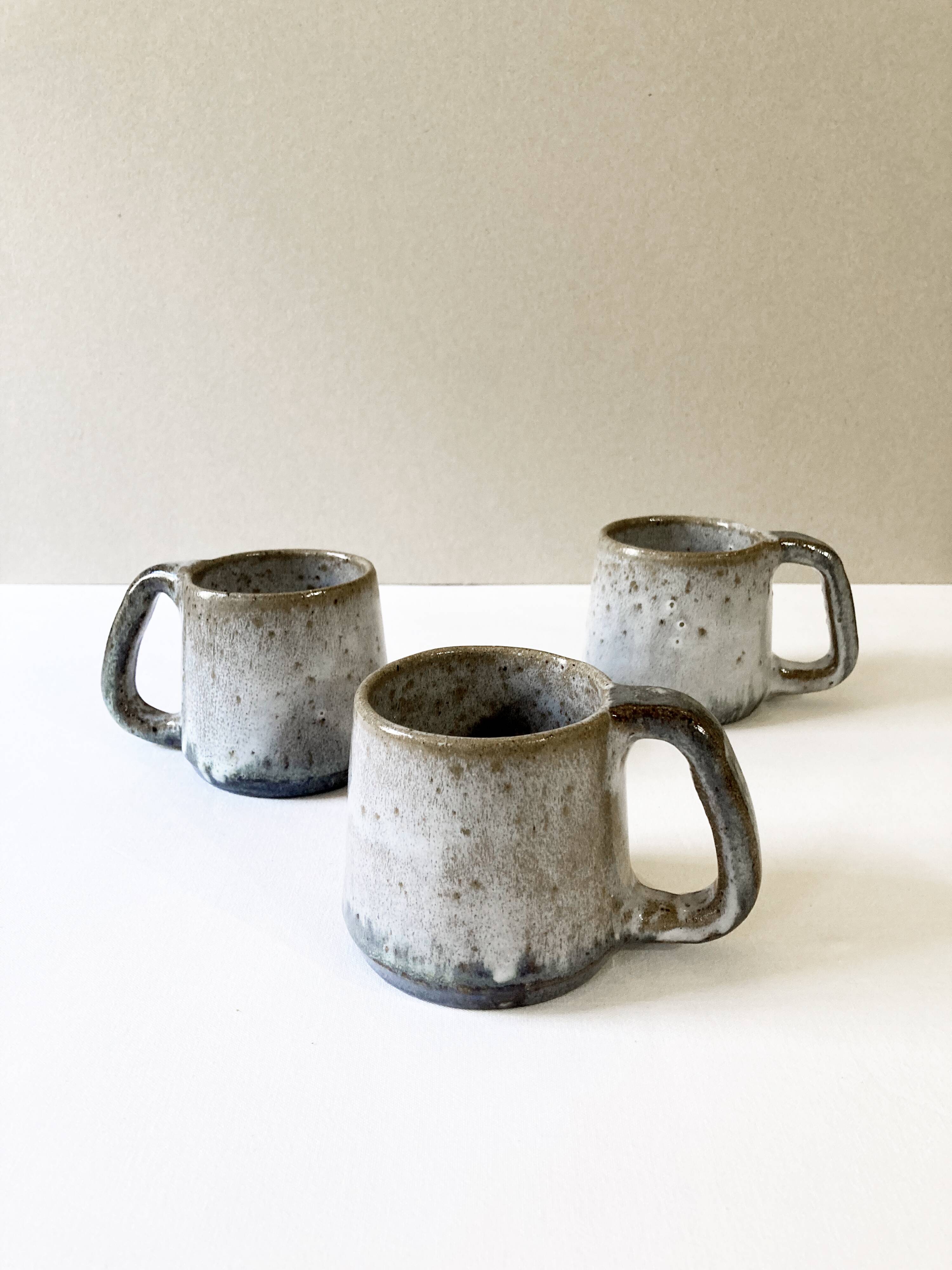 Trio of stoneware mugs