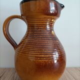 Orange glazed ceramic pitcher