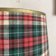 Turned wooden lamp, tartan lampshade.