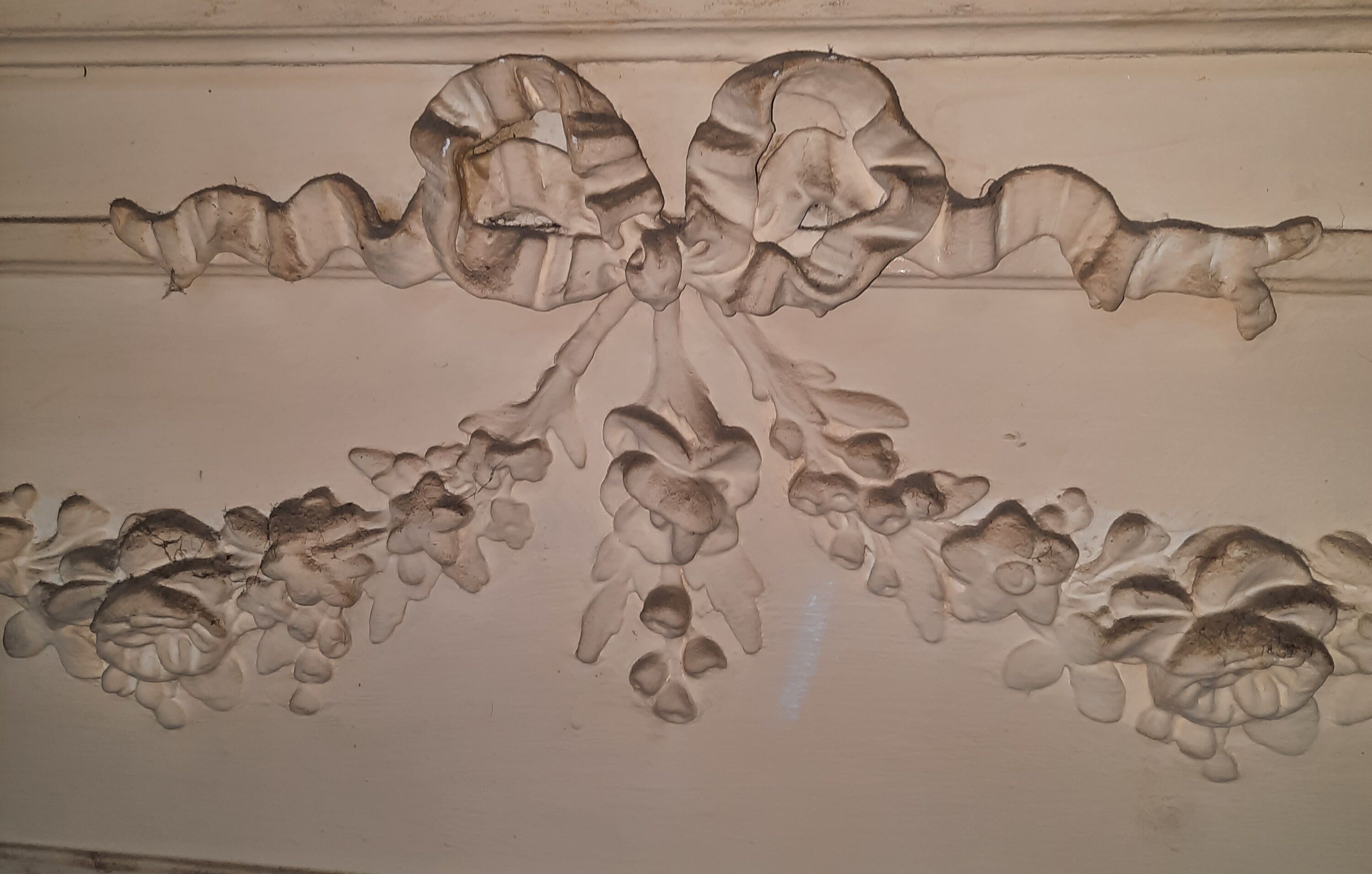 White painted wood paneling mirror