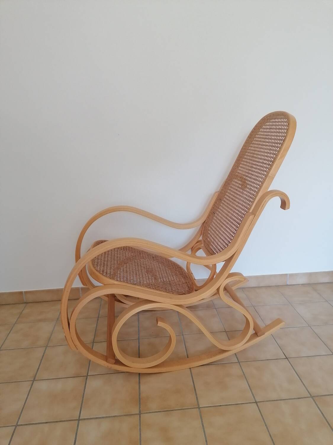 Wooden and cane rocking chair
