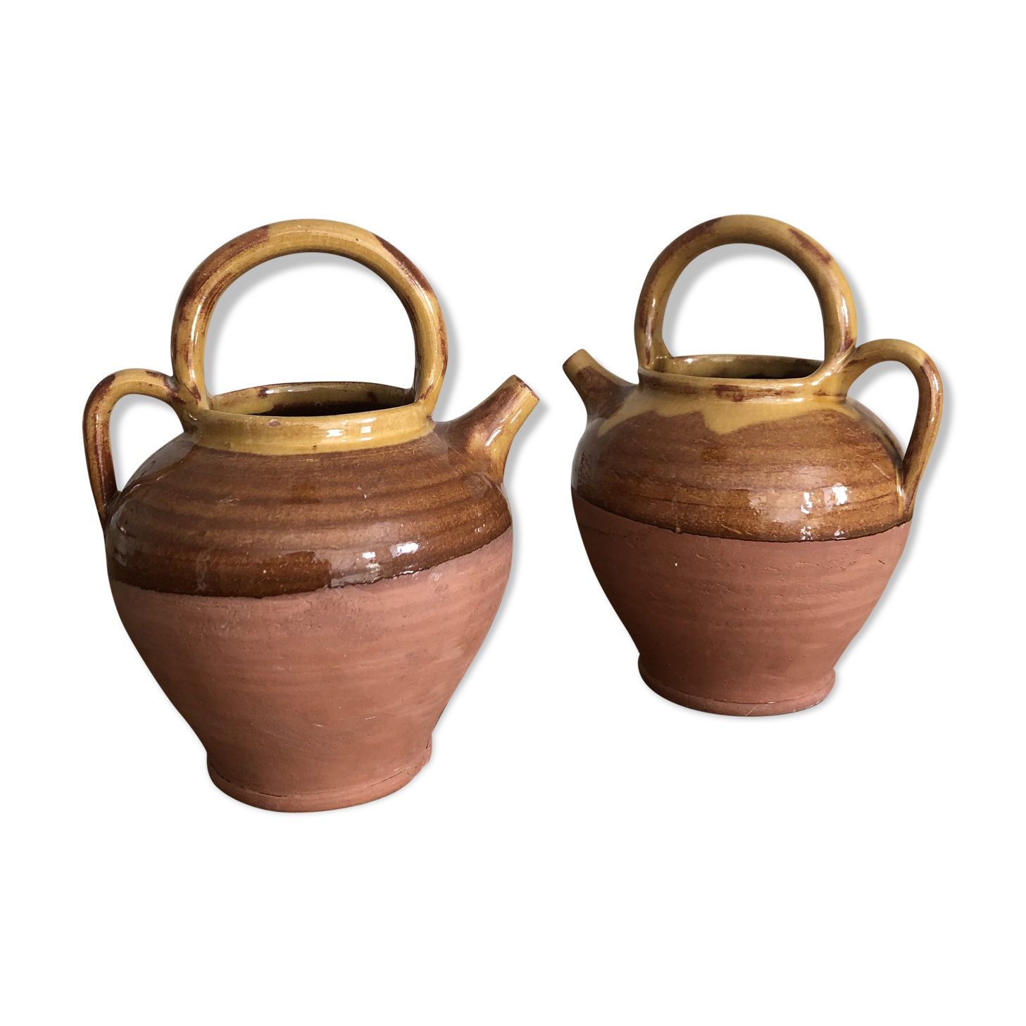 Pair of vintage terracotta watering cans