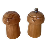 Salt and pepper shakers in wood shaped like a champagne cork.