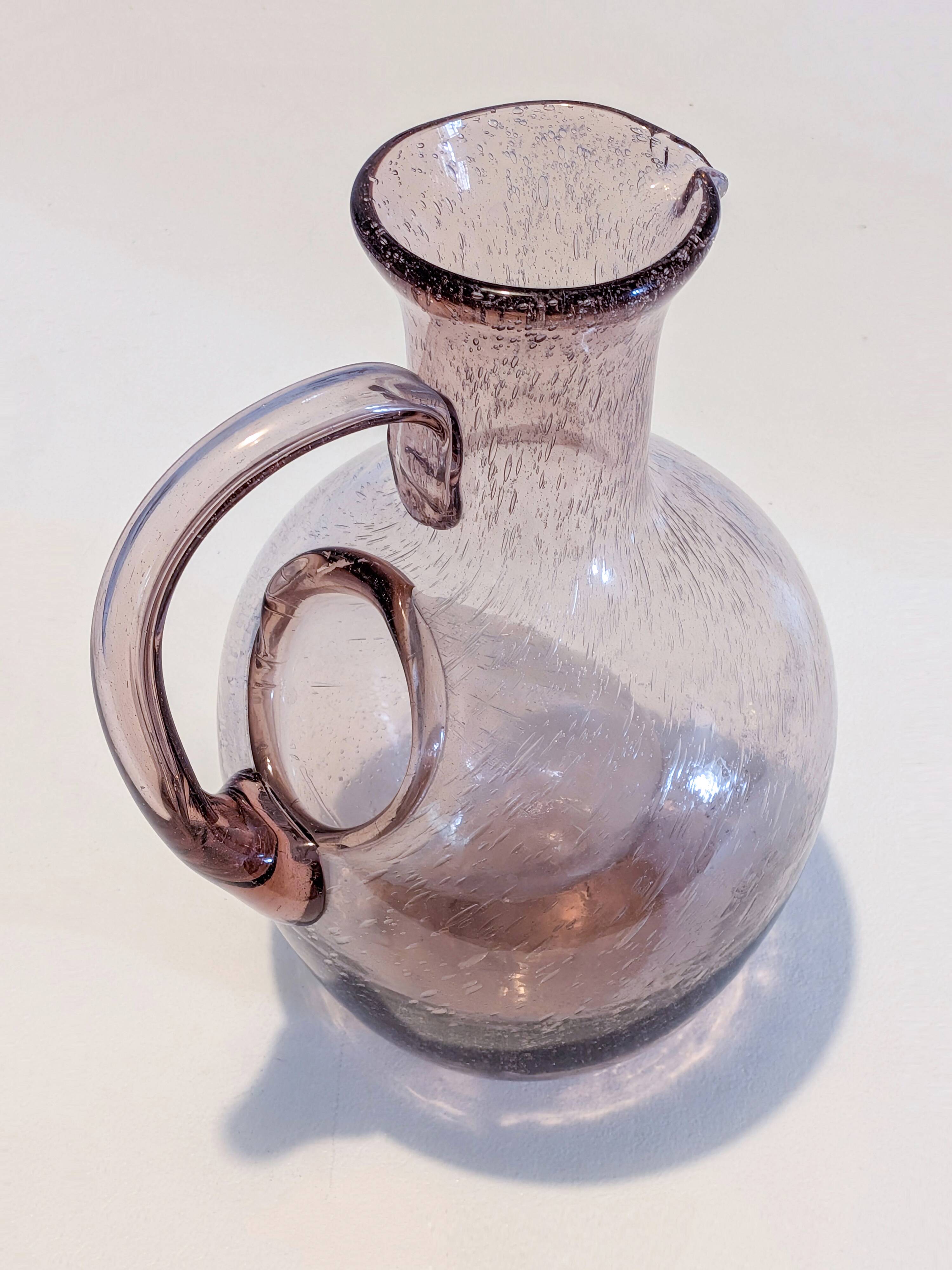 Large ice pitcher from Verrerie de Biot in amethyst bubble glass.