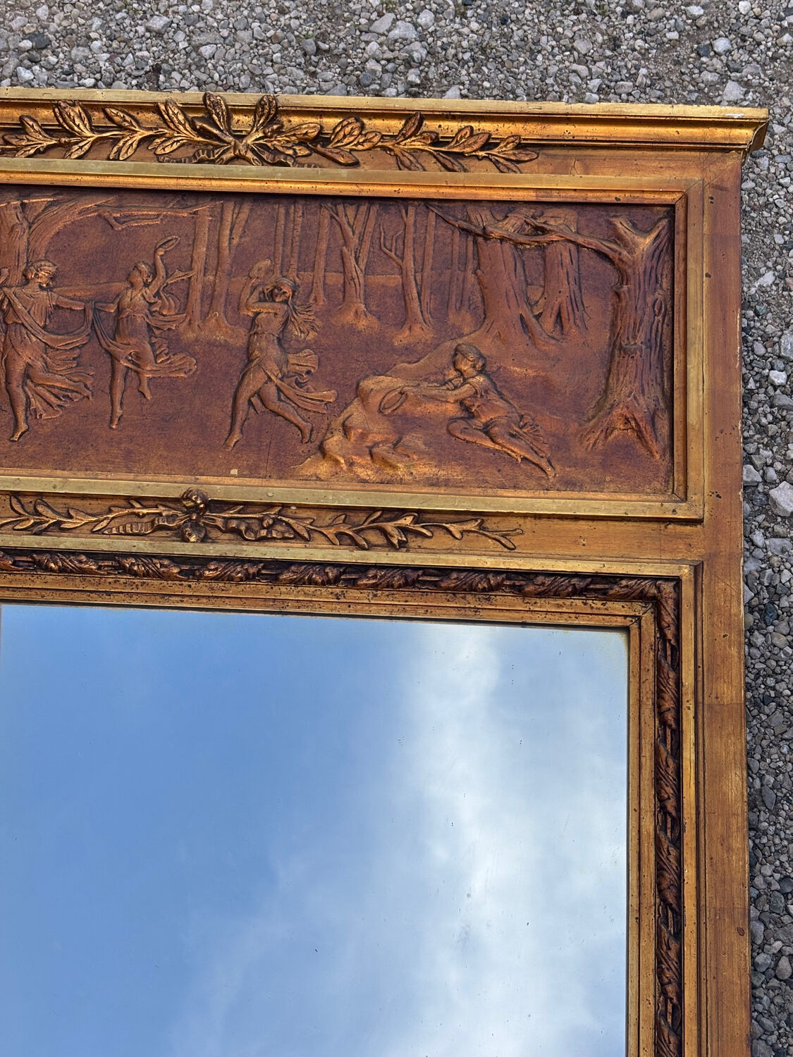 Golden trumeau mirror in Louis XVI style, 20th century.