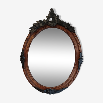 Miroir ancien ovale avec moulures noir et bois