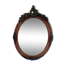Miroir ancien ovale avec moulures noir et bois